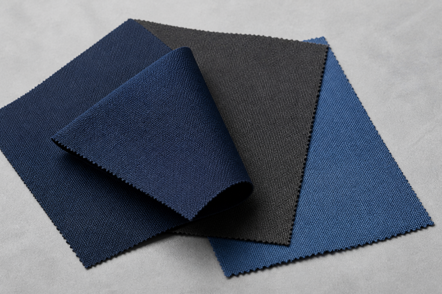 Woven navy, charcoal and blue polyester-direction swatches