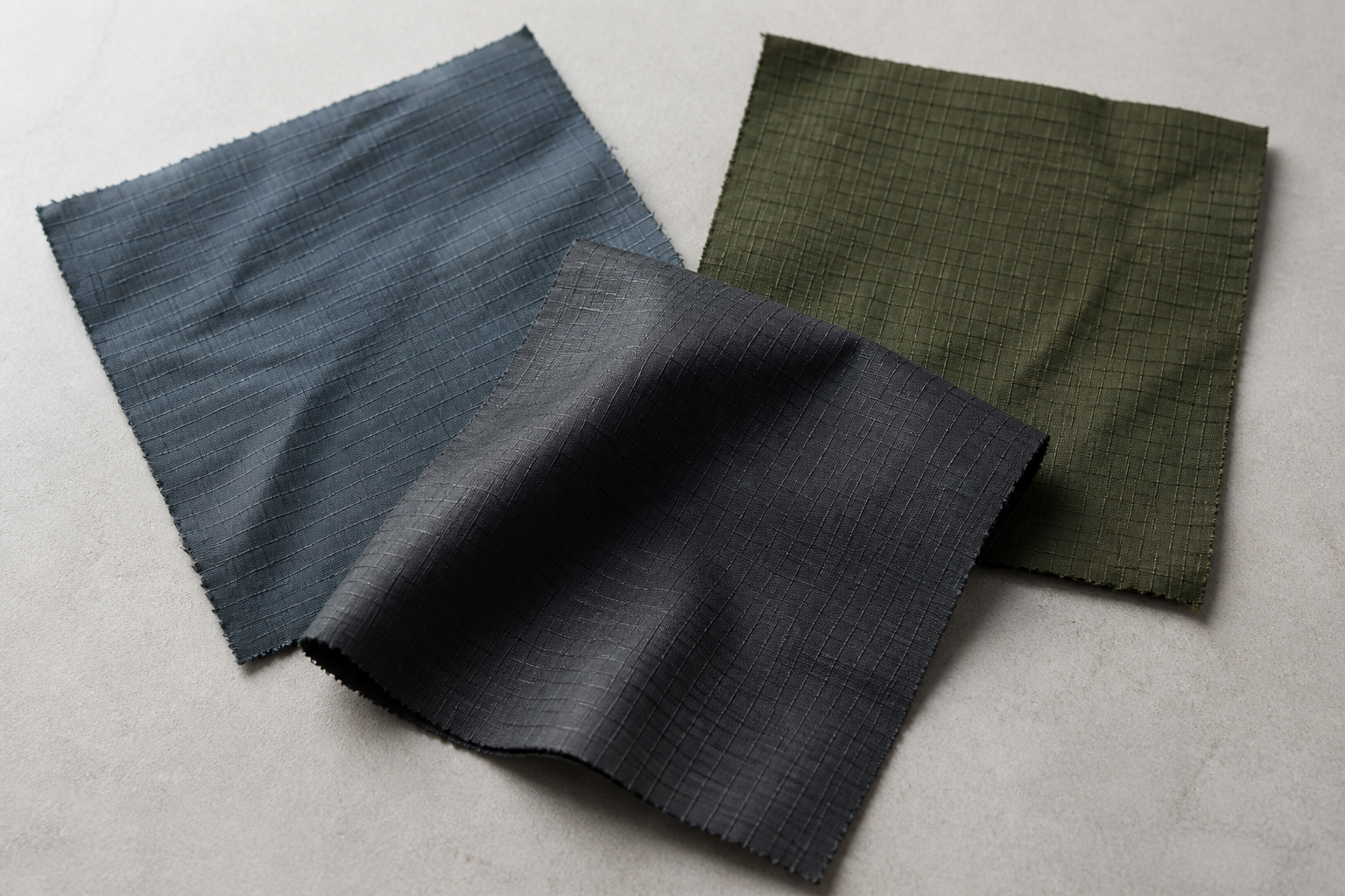 Blue, olive and charcoal grid-weave ripstop swatches